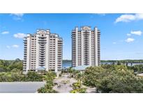 Two high rise waterfront buildings with parking and landscaping at 13427 Blue Heron Beach Dr # 405, Orlando, FL 32821