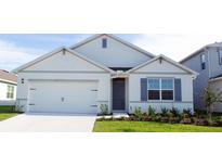 Charming one-story home with gray shutters and a two car garage at 1067 Griffon Ave, Lake Alfred, FL 33850