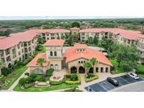 Aerial view of community with pool and clubhouse at 901 Charo Pkwy # 732, Davenport, FL 33897