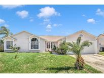 Charming house with light-colored siding and a well-kept lawn at 5920 Norvale Ct, Orlando, FL 32808