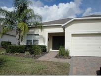 Single-Gathering home with two-car garage and landscaping at 346 Kildrummy Dr, Davenport, FL 33896