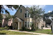 Two-story home with charming curb appeal and landscaping at 3392 Westchester Square Blvd # 101, Orlando, FL 32835