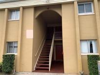 Building exterior with stairs and entrance at 1000 Lake Of The Woods Blvd # C205, Fern Park, FL 32730