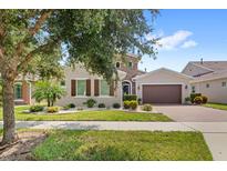 Beautiful two-story home with landscaped yard at 290 Silver Maple Rd, Groveland, FL 34736