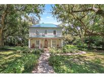 Charming two-story house with a lush green lawn at 2301 Ne 97Th Street Rd, Anthony, FL 32617