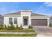 One-story home with a two-car garage and well-manicured landscaping at 4945 Worchester Dr, Kissimmee, FL 34746