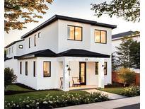 Stunning two-story modern home with white exterior and black accents at 33 S Graham Ave, Orlando, FL 32803