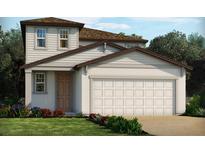 Two story home with two car garage and attractive landscaping at 1365 Current Pl, Haines City, FL 33844