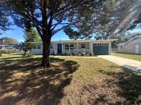 Newly renovated home with a spacious yard and modern curb appeal at 111 Lake Dot Dr, Sanford, FL 32773