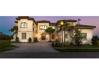 Luxury home exterior with a grand entrance at 925 Desert Mountain Ct, Reunion, FL 34747