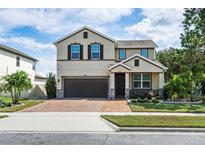Two-story house with a two-car garage at 5200 Landmark Dr, St Cloud, FL 34771
