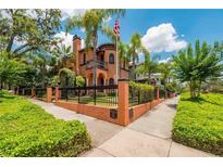Beautiful two-story home with manicured landscaping and a gated entrance at 503 N Summerlin Ave, Orlando, FL 32803