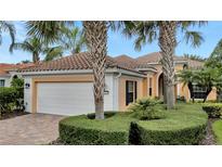 One-story house with a white garage door and brick driveway at 12203 Pasha Ln, Orlando, FL 32827