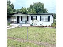 Charming single story home with a well-manicured lawn at 1206 Perkins Rd, Orlando, FL 32809