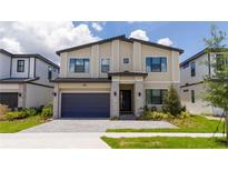 Two-story modern home with attached garage and landscaping at 5887 High Seas Dr, Orlando, FL 32821