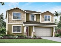 Two-story home with a charming exterior and two-car garage at 12934 Promise Pl, Orlando, FL 32832