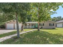 House exterior with two-car garage and front yard at 233 S 4Th St, Lake Mary, FL 32746