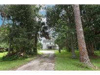 Charming house nestled among mature trees, offering privacy and curb appeal at 2341 Celery Ave, Sanford, FL 32771