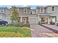 Modern townhouse exterior with two-car garage at 3663 Circle Hook St, Kissimmee, FL 34746