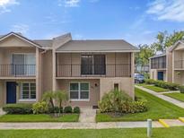 Two-story townhouse with balcony and landscaping at 881 Town Cir # 129, Maitland, FL 32751