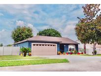 Charming curb appeal with two-car garage and landscaped yard at 2019 Jaffa Ct, Clermont, FL 34714