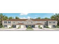 Three-unit townhome building with attached garages at 2116 Gentle Rain Dr, Edgewater, FL 32141