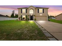 Two-story house with a landscaped lawn and driveway at 3227 Shingler Ter, Deltona, FL 32738