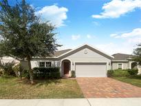 Attractive house with a brick paver driveway at 920 Benjamin Trl, Davenport, FL 33837