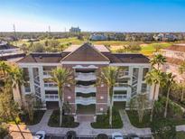 Aerial view of a multi-unit building near a golf course at 7602 Sandy Ridge Dr # 102, Kissimmee, FL 34747