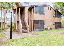 Exterior view of condo building with stairs at 3043 Antique Oaks Cir # 171, Winter Park, FL 32792