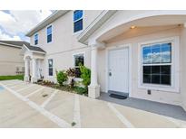 Two story building exterior with front entrance and landscaping at 210 Majors Ln # B, Kissimmee, FL 34743