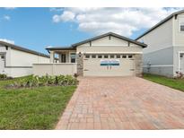 Single-Gathering home with a brick driveway at 523 Kennedy Dr, Lake Alfred, FL 33850