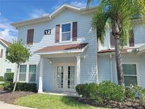 Light blue two story building with brown trim at 8959 Shine Dr, Kissimmee, FL 34747