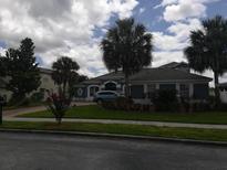 Two-story home with palm trees and landscaping at 13639 Glynshel Dr, Winter Garden, FL 34787