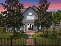Two-story house with a double front door and landscaped yard at 1451 Lyndale Blvd, Winter Park, FL 32789