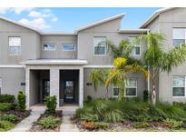 Modern townhouse exterior with landscaping at 1224 Challenge Dr, Davenport, FL 33896