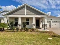 Two-story home with stone accents and landscaping at 5013 Center Ct, St Cloud, FL 34772