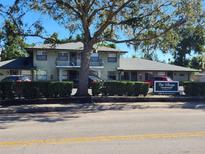 The Village Condominiums building exterior, showcasing landscaping and parking at 500 N Pennsylvania Ave # E, Winter Park, FL 32789