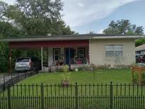 Cozy one-story house with carport and fenced yard at 522 W Park St, Lakeland, FL 33803