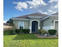 One story house with a well maintained lawn at 2581 Wadeview Loop, Saint Cloud, FL 34769