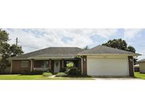 Brick house with a two-car garage and nice landscaping at 2727 N Juliet Dr, Deltona, FL 32738