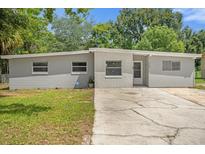 Newly painted house with a well-maintained lawn at 3133 Bon Air Dr, Orlando, FL 32818