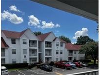 Exterior view of a two story residential building with red roof at 11544 Westwood Blvd # 1325, Orlando, FL 32821