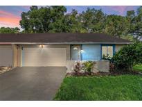 Cute light blue house with attached garage at 108 Clear Lake Cir, Sanford, FL 32773