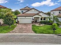 Two-story house with brick driveway at 1890 Altavista Cir, Lakeland, FL 33810