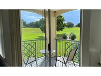 Private balcony overlooking a lush golf course at 7310 Westpointe Blvd # 623, Orlando, FL 32835