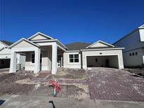 New construction home with brick driveway and landscaping at 5229 Prairie Preserve Run, Saint Cloud, FL 34772