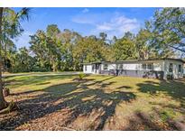 Newly renovated home with modern exterior and spacious yard at 758 Osceola Dr, Sanford, FL 32773