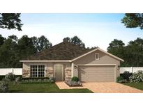 Charming one-story home with stone accents and a two-car garage at 2585 Cavanaugh Dr, Orlando, FL 32817