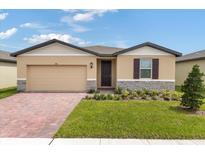 New construction home with a two-car garage at 3150 Viceroy Ct, Poinciana, FL 34759